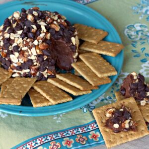 Nutella Dream-Cheese Ball with graham crackers on a plate