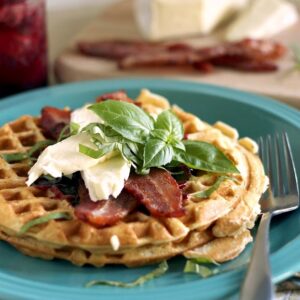 Bacon, Brie, and Basil Waffle on a blue plate