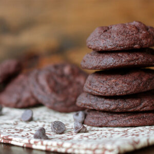 Death by Chocolate Cookies stacked on a napkin