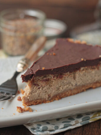 A slice of lentil cheesecake with chocolate ganache