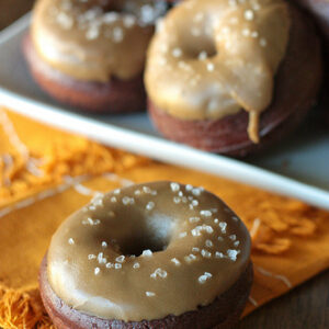Salted caramel chocolate doughnuts on a platter