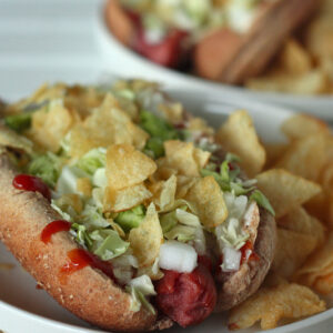Venezuelan Hot Dog topped with cabbage and chips