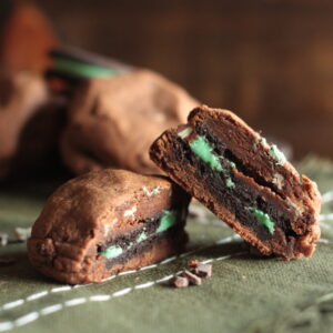 Double Chocolate Mint Oreo Stuffed Cookies cut in half and stacked