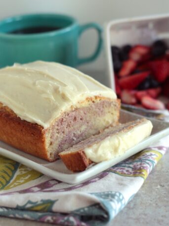 Raspberry Swirl Pound Cake with a slice cut