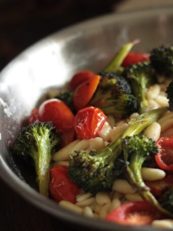 Roasted Tomato and Broccoli Summer pasta skillet cooking in a pan