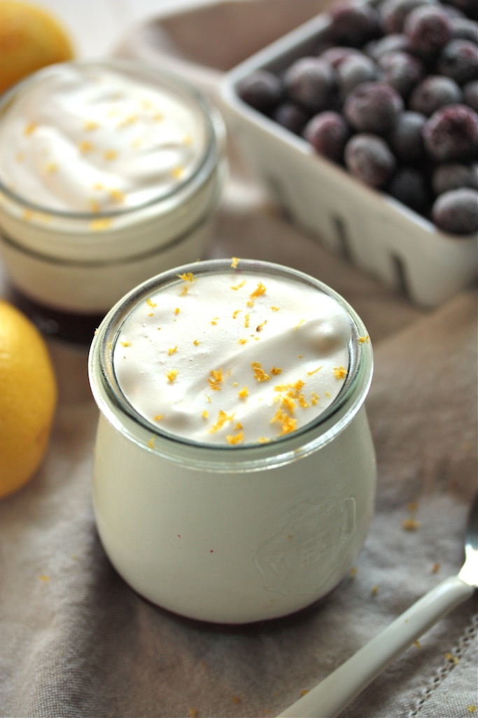 Two jars of lemon mousse topped with lemon zest