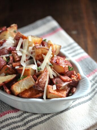Roasted Potatoes with Bacon Parmesan Vinaigrette in a dish