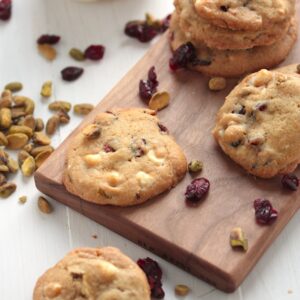 Overhead view of Cranberry White chocolate cookies on a wooden board