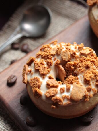 Overhead view of a Gingerbread Coffee Baked Donut on a wooden board