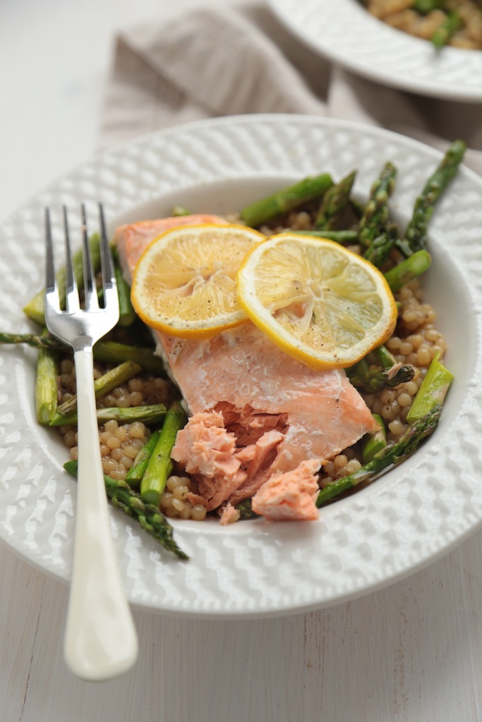 Overhead view of Wild Salmon with Cous Cous and Roasted Asparagus on a plate