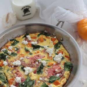 Overhead view of Sweet Potato and Spring Vegetable Frittata in a pan