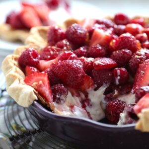 No Bake Sour Cream Berry Pie with a slice removed
