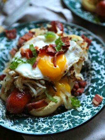 Breakfast Hot Dog - Topped with crispy hashbrowns, a sunny side up egg, cilantro and BACON, duh! - homemadehome.com