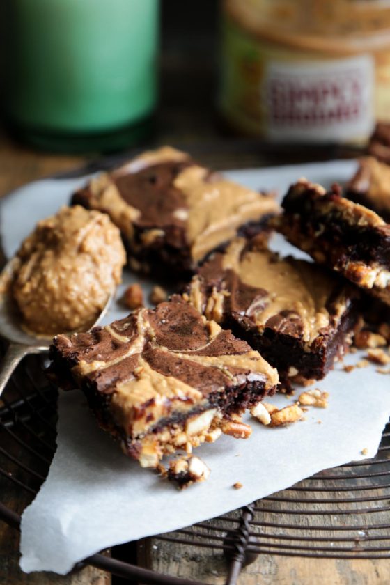 Chocolate Peanut Butter Brownies with Pretzel Crust - The ultimate brownie with swirled peanut butter and a sweet and salty pretzel crust! This easy dessert recipe will have you eating them out of the pan! 