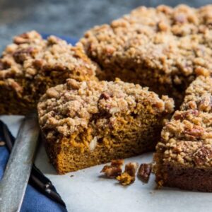 Pumpkin Gingerbread Coffee Cake slices on a blue background