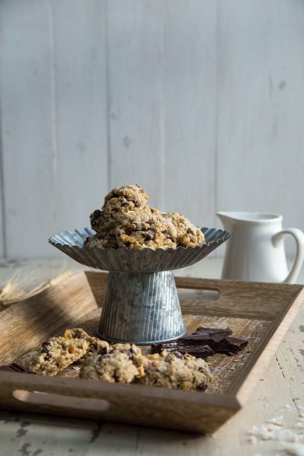 World's BEST Lactation Cookies on a cake stand and. cookies surrounding it