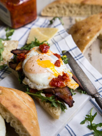 Bacon Egg and Arugula Breakfast Sandwich on Focaccia Bread