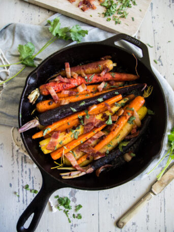 Sweet and Spicy Gochujang and Bacon Carrots in cast iron skillet