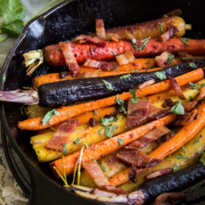 Sweet and Spicy Gochujang and Bacon Carrots in cast iron skillet