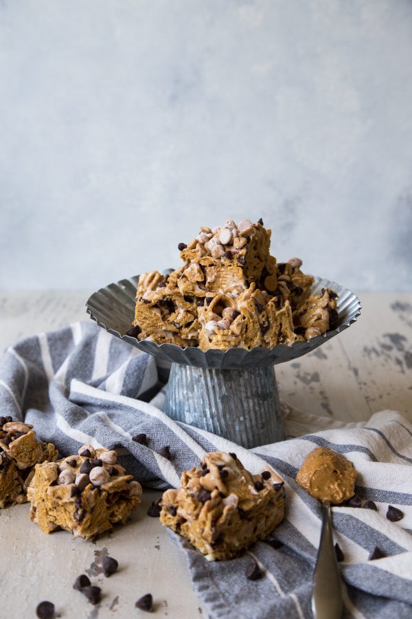 Peanut Butter Graham S'mores treats on a galvanized treat stand on a white and blue napkin