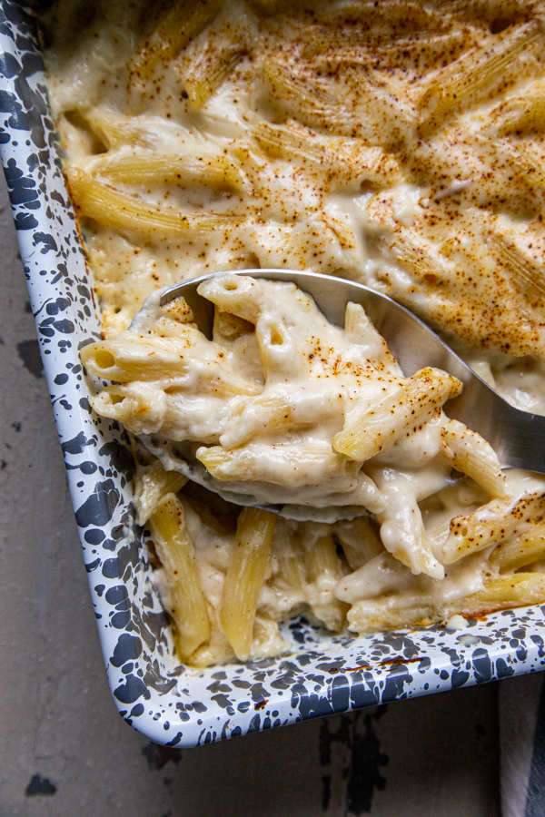 Beecher's mac and cheese in a gray and white speckled baking dish