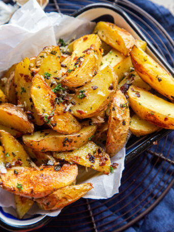 Garlic Parmesan fries in parchment-lined dish