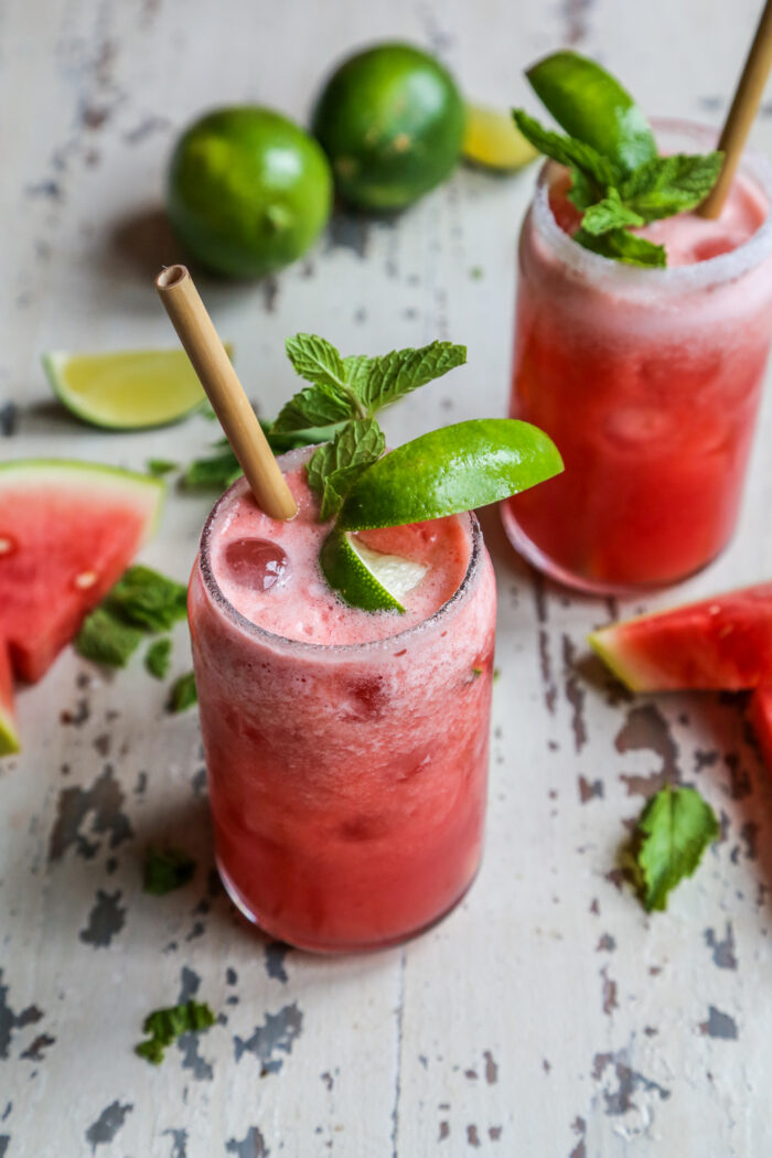 Watermelon guava agua fresca in a beer can glass garnished with mint
