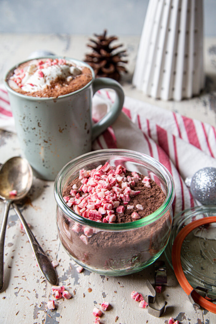 Peppermint Hot Cocoa Mix on a distressed background in a mason jar